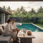 Un couple français consulte un ordinateur portable sur la terrasse d’une villa moderne à Bali, utilisant un prêt hypothécaire pour acheter à Bali pour financer leur bien.